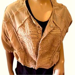 Adorable, distressed shrug with buttons and pockets.